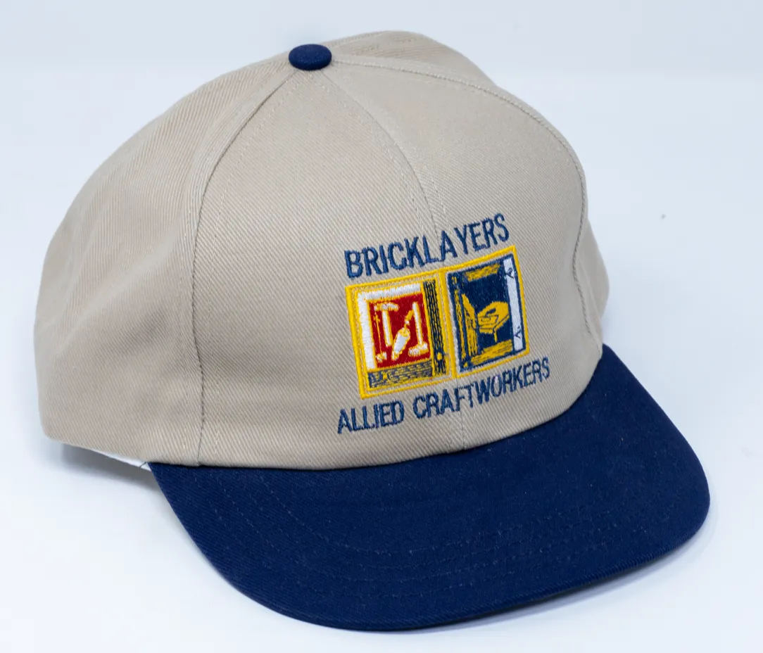 C25 - TAN CAP WITH NAVY BILL AND EMBROIDERED IU LOGO